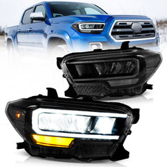 A pair of VLAND LED headlights for 2016-2023 Toyota Tacoma vehicles, displayed alongside the Tacoma truck.